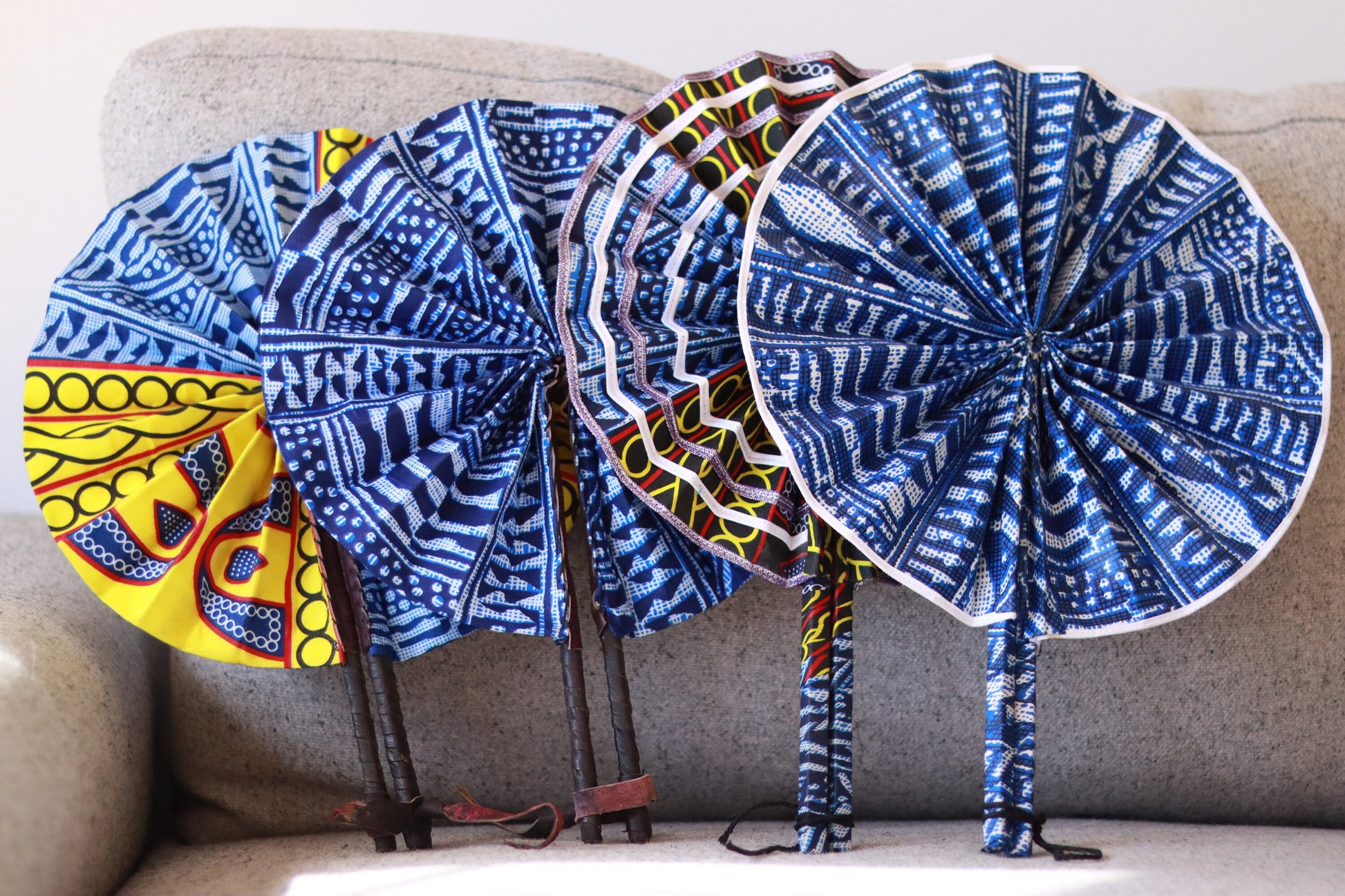 Bamileke Ndop Hand Fan: Handcrafted African Folding Accessory with Traditional Fabric Print