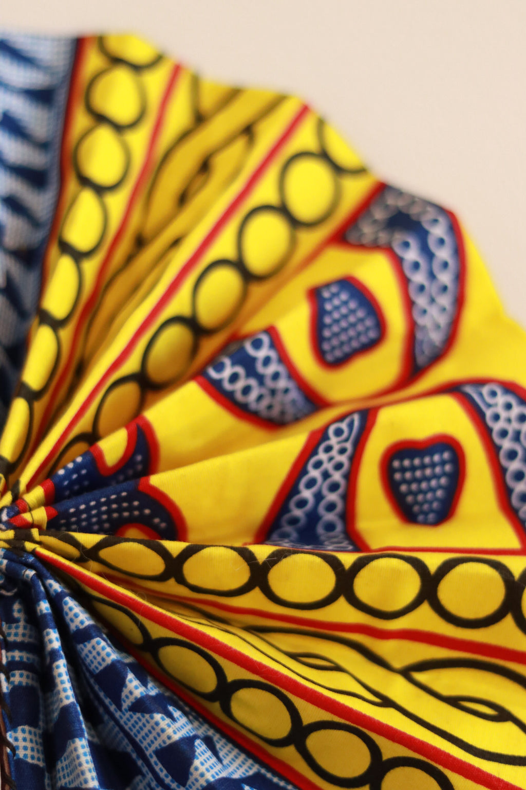 Bamileke Ndop Hand Fan: Handcrafted African Folding Accessory with Traditional Fabric Print